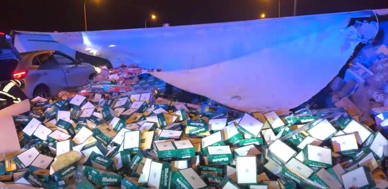 Beer flows across M-50 in Madrid after truck overturns